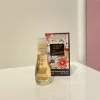 بطری ۱۵ میل عطر گوچی فلورا | Gucci Flora برند اسمارت با طراحی ظریف و شفاف در پس‌زمینه‌ای ساده.