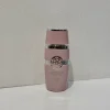 بطری 25 میل عطر زنانه لطافه یارا صورتی شرکت سوپر اسمارت با طراحی صورتی مینیمال و قابل‌حمل در پس‌زمینه‌ای مینیمال.